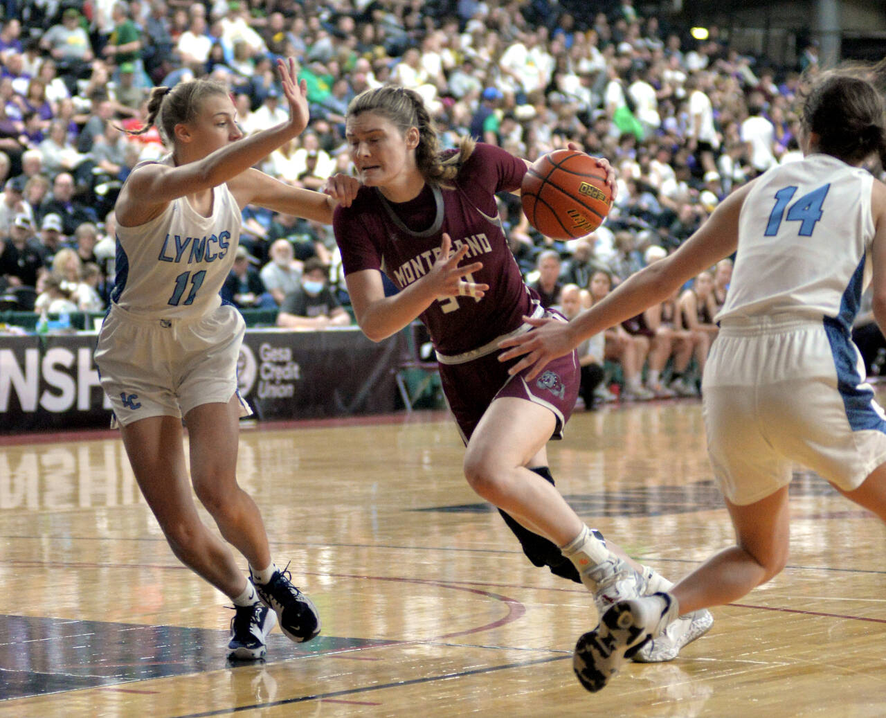 RYAN SPARKS | THE DAILY WORLD Montesano junior McKynnlie Dalan (34) drives to the basket against Lynden Christian’s Lexi Kaptein during the Bulldogs’ 57-32 loss in the 1A State Tournament semifinals on Friday in Yakima.