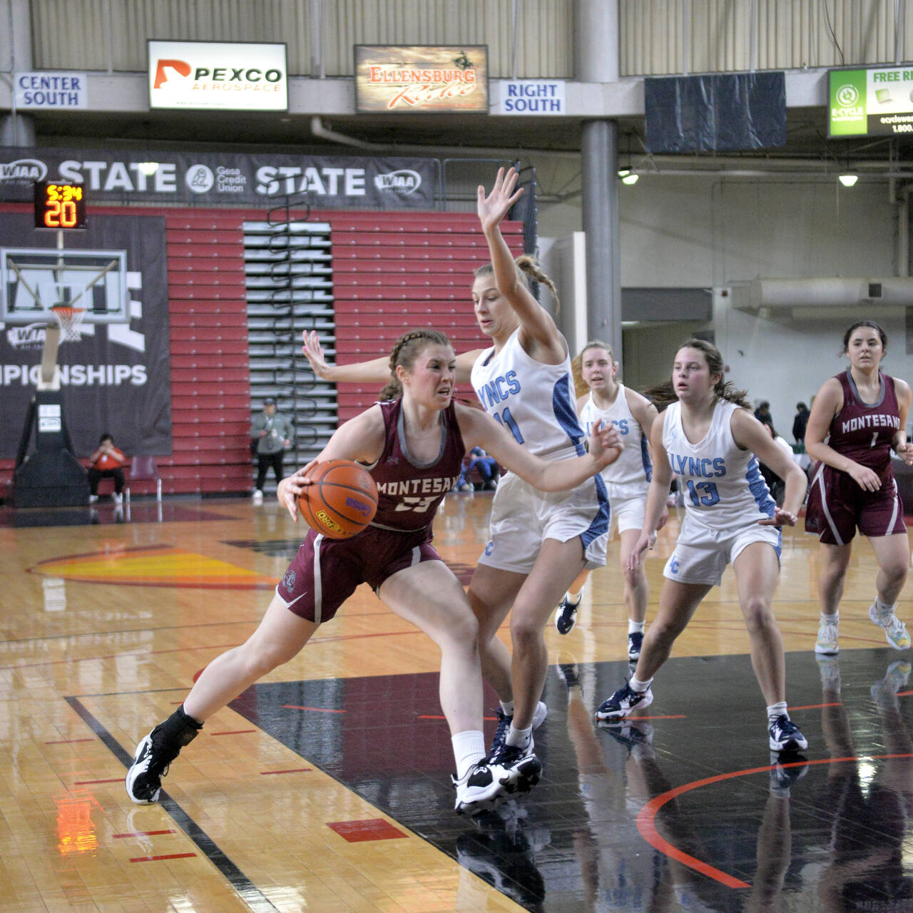 RYAN SPARKS | THE DAILY WORLD Montesano senior Paige Lisherness (23) drives against Lynden Christian’s Lexi Kaptein during the Bulldogs’ 57-32 loss in the 1A State Tournament semifinals on Friday in Yakima.