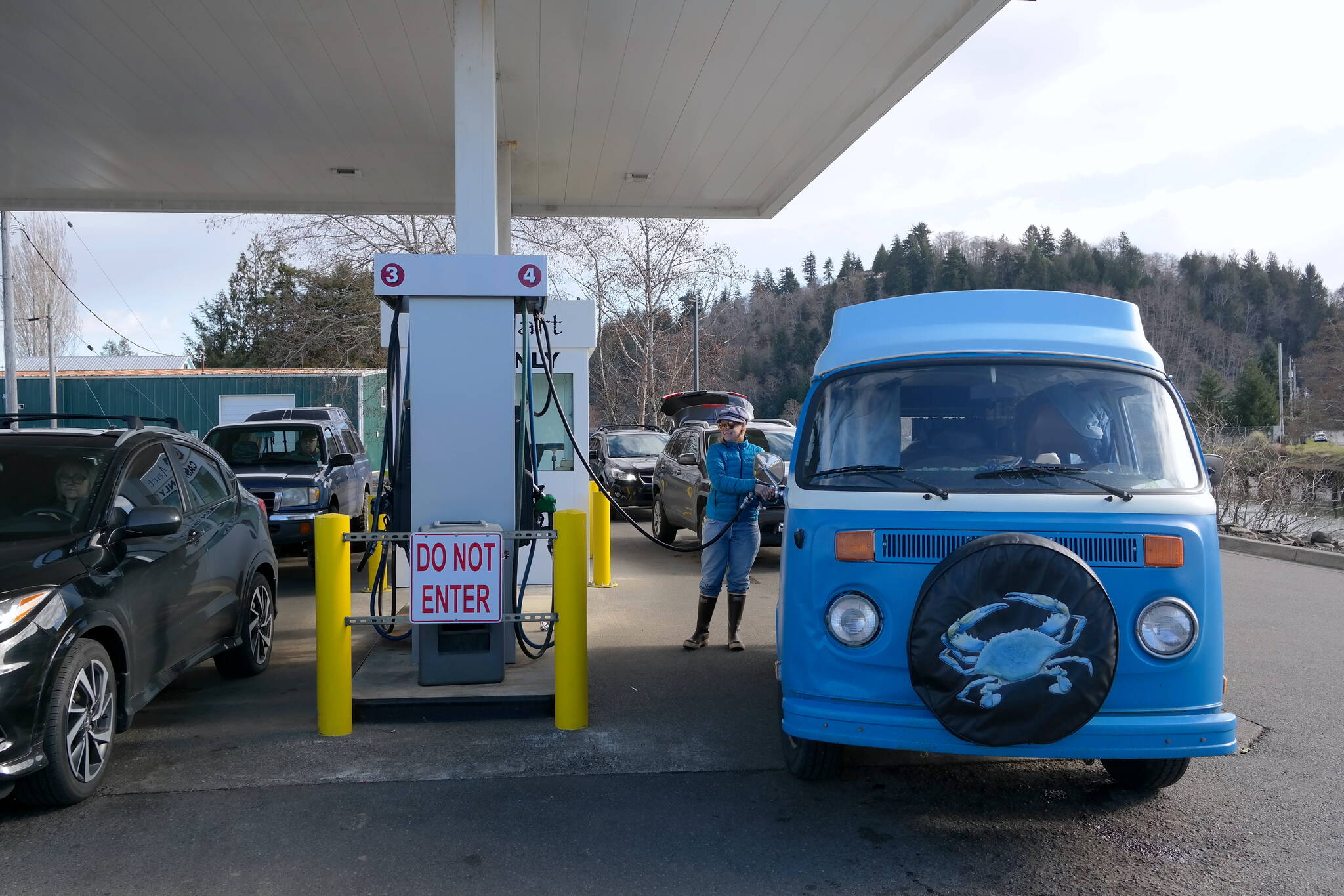 Erika Gebhardt I The Daily World 
Grays Harbor County resident Willow Jorgenson fills up at the Q-Mart in Aberdeen on Wedensday, March 9, 2022. Soaring gas prices are likely to alter her plans for excursions along the coast in the coming months.