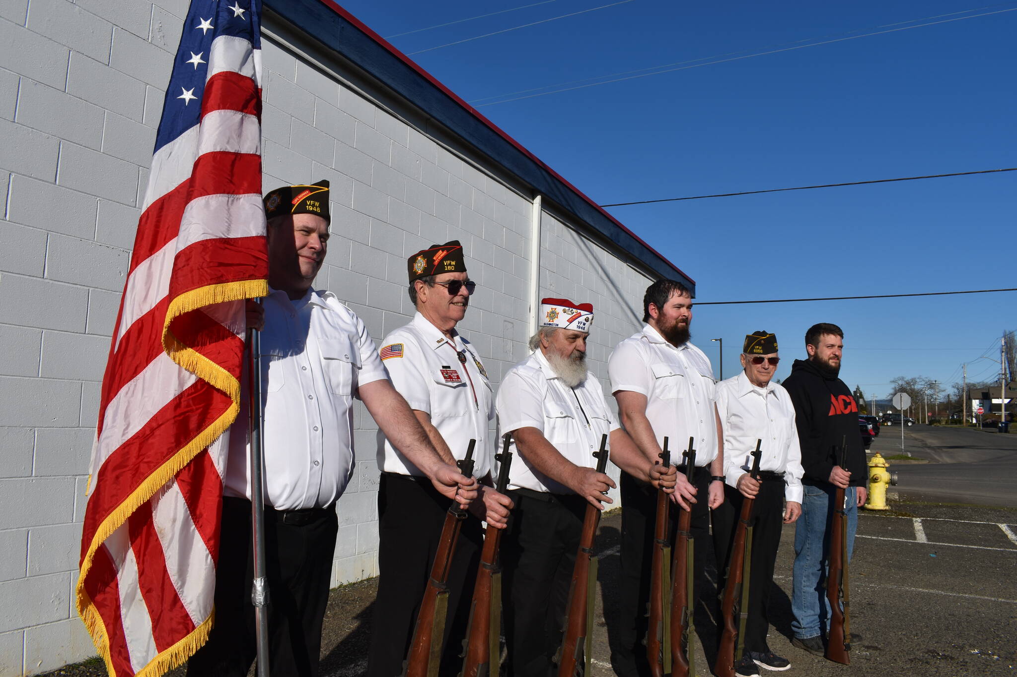 Photos by Matthew N. Wells | The Daily World
Elma VFW Bill Mann Post 1948 members (from left to right) Jim Mears, Tyler Marriott, Bill Wickwire, Cody Fries, Chuck McLane and Brad Dendy line up with an American flag and the seven ceremonial M1 Garand rifles that, once stolen, have since been recovered.