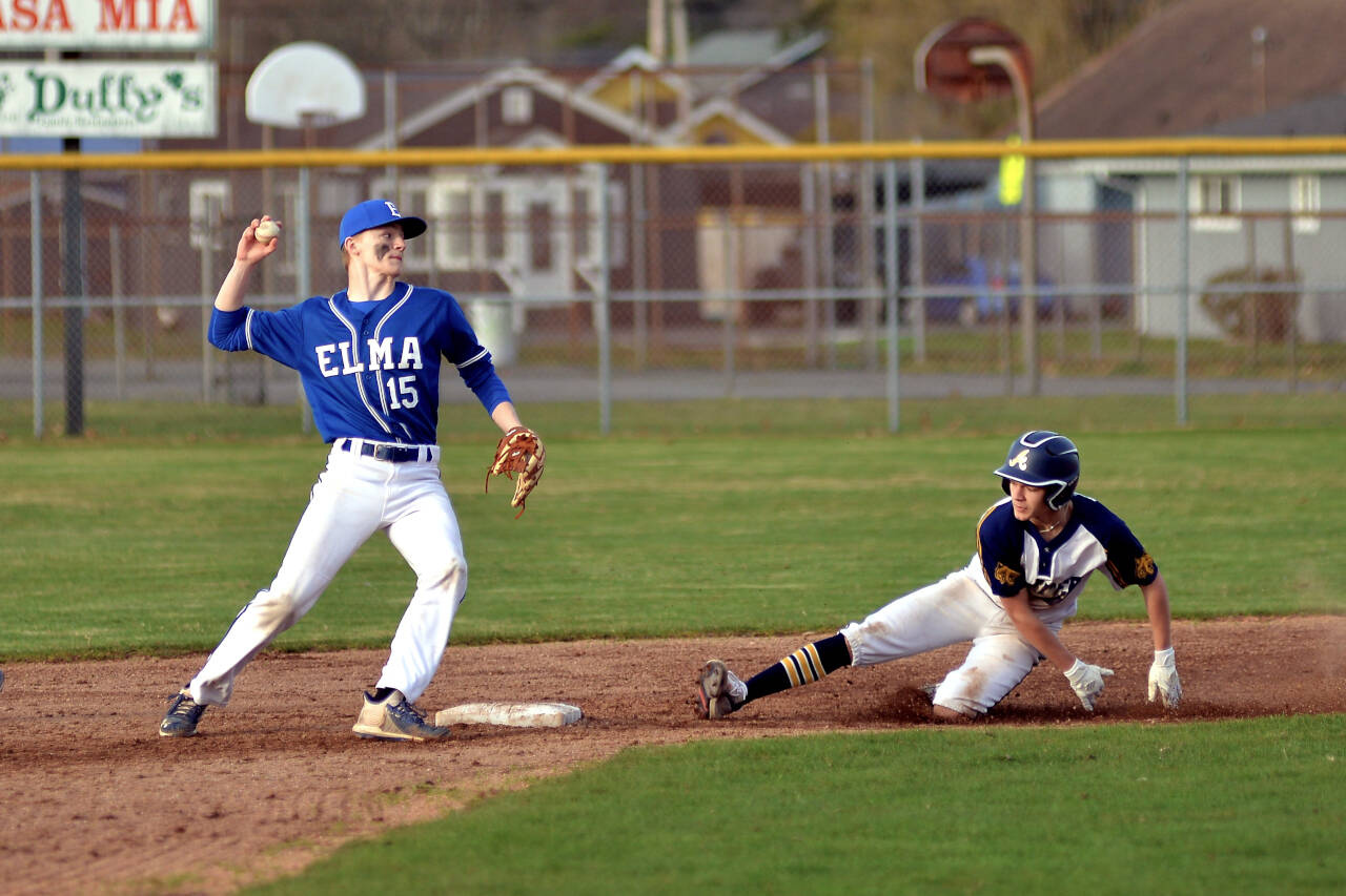 RYAN SPARKS | THE DAILY WORLD
Elma infielder JT Tiffany (15) turns a double play on Aberdeen’s Kyle Miller during Aberdeen’s 6-1 win on Thursday, March 24, 2022, at Pioneer Park in Aberdeen.
