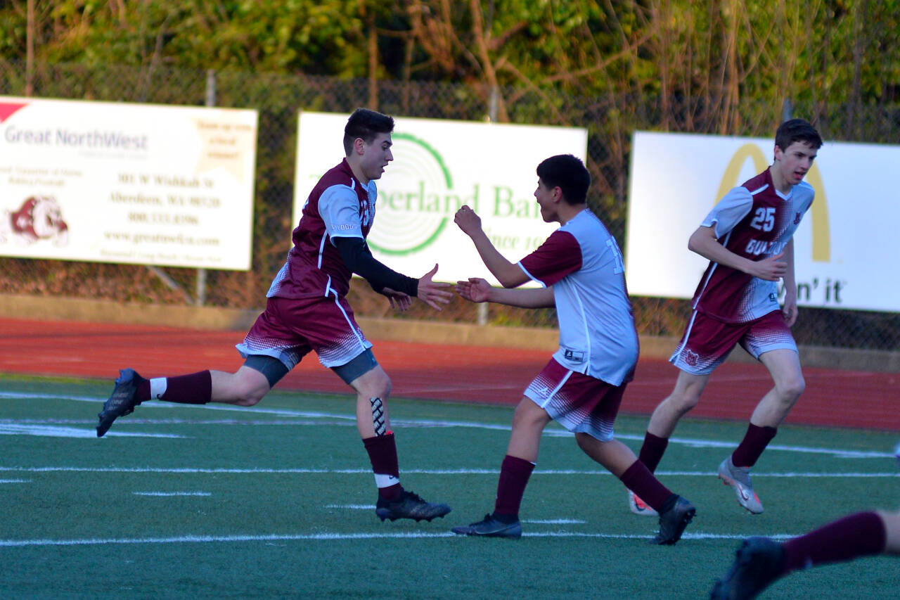 RYAN SPARKS | THE DAILY WORLD Montesano forward Felix Romero, left, celebrates with teammate Jiovanny Torres after scoring a goal in the 6th minute against Elma on Wednesday in Montesano.