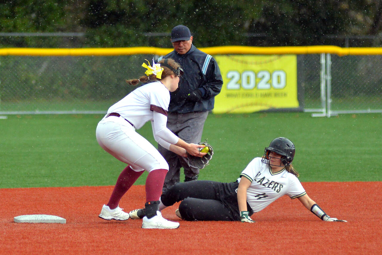 RYAN SPARKS | THE DAILY WORLD Montesano shortstop Paige Lisherness, left, tags out Timberline’s Kenzie Reanier-Briggs during the Bulldogs’ 10-3 loss on Friday in Montesano.