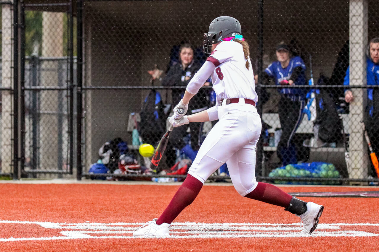 PHOTO BY SHAWN DONNELLY Montesano senior Paige Lisherness (8) hits a grand slam home run in the seventh inning in a 10-5 win over Eatonville on Friday in Montesano.