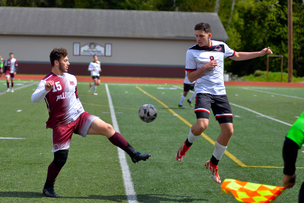 RYAN SPARKS | THE DAILY WORLD Montesano’s Mateo Sanchez (15) moves the ball forward against Columbia-White Salmon’s Dylan Connely in the Bulldogs’ 2-0 loss on Saturday in Montesano.