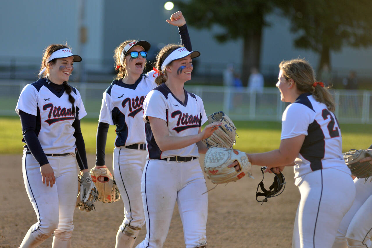 RYAN SPARKS | THE DAILY WORLD Pe Ell-Willapa Valley left fielder Grace Huber, second from right, is congratulated by her teammates after making a diving catch to end the top of the sixth inning in an 11-1 win over the Onalaska Loggers in the 2B District 4 semifinals on Friday in Centralia.
