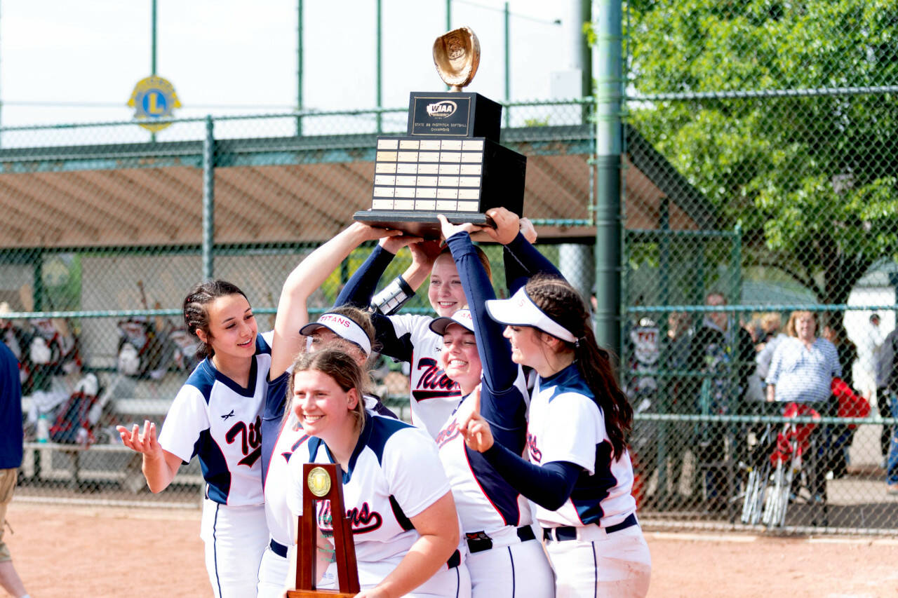 ALEC DIETZ | THE CHRONICLE PWV players hoist the 2B State Championship trophy after defeating Adna 11-0 in five innings on Saturday in Yakima. It’s the first state softball championship for the school since 2017.