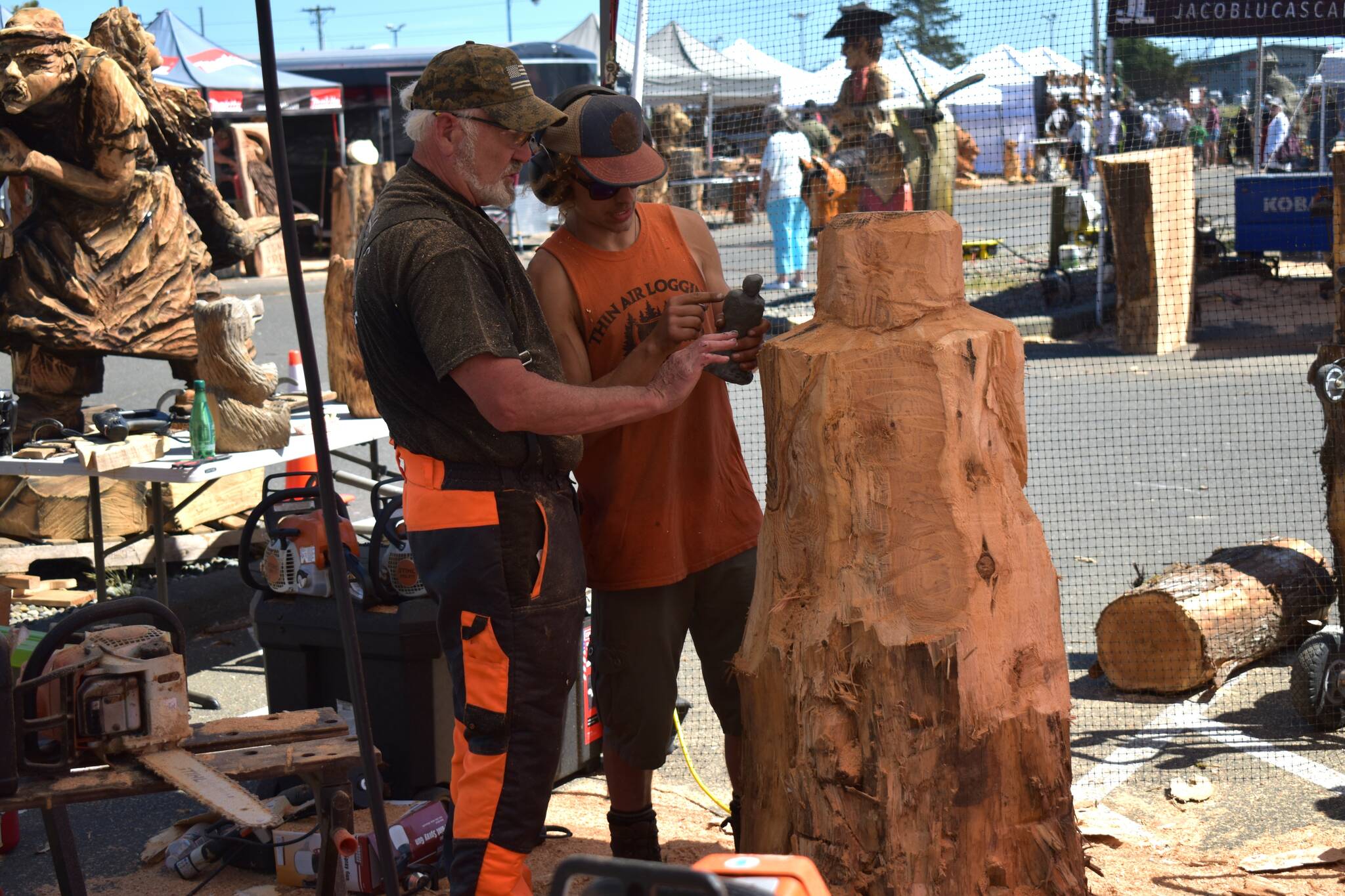 Allen Leister | The Daily World 
Carvers spend hours turning their visions into reality before being put into the auction. All carvers had to produce at least three pieces every day at the Sand & Sawdust Festival in Ocean Shores.