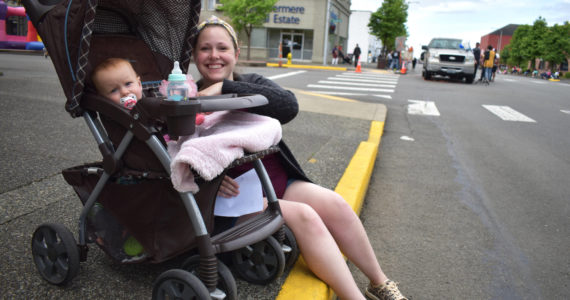 Matthew N. Wells | The Daily World
Hana and her 11-month-old daughter Hazel Lichty await the festivities of the Aberdeen Founder’s Day Parade on Saturday, July 2, 2022, near South Broadway Street and East Market Street.