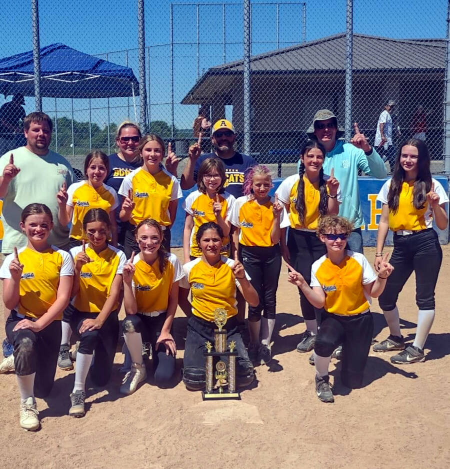 SUBMITTED PHOTO The Aberdeen all-star 12U softball team won the Cascade League district championship with a 22-10 win over Hoquiam on Saturday, June 26 in Aberdeen. Pictured are (front row, from left) Jordyn Mills, Kylie Wilson, Ailyn Haggard, Klementine Servellon, Emily McGrath. Middle row: Dahly Vessey, Presley Stone, Kalena Rhoads, Arya Siegel, Olivia Perez, Kamryn Turpin. Back row: Coaches Rory Rhoads, Cassandra Koonrad, Todd Wilson and John McGrath.