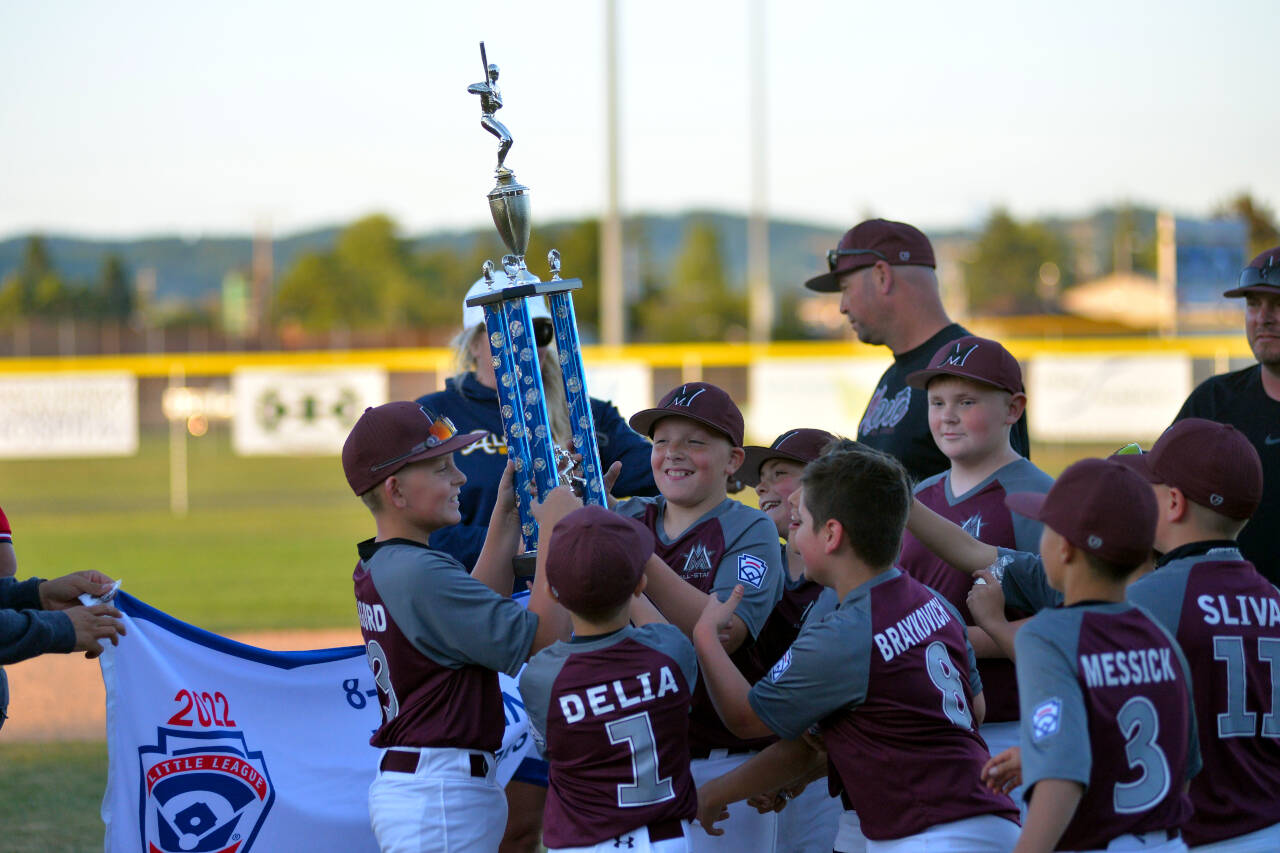 RYAN SPARKS | THE DAILY WORLD The Montesano Little League All-Stars hoist the 10U District 3 trophy after defeating Larch Mountain 13-11 on Thursday at Pioneer Park in Aberdeen.