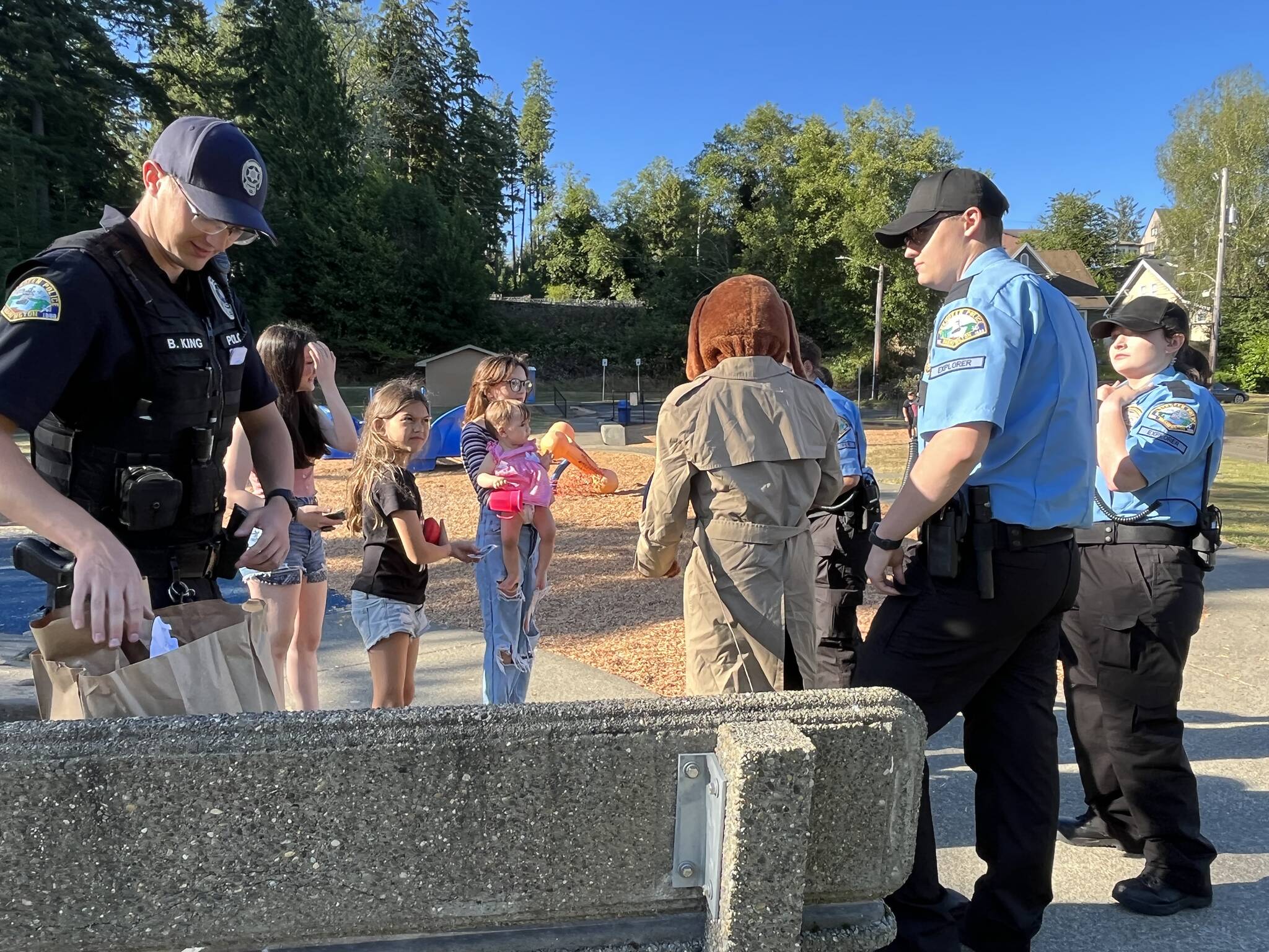 Matthew N. Wells | The Daily World
Aberdeen Police Department officers, and Aberdeen Police Explorers, and McGruff the Crime Dog, happily interact with local children during National Night Out on Tuesday, Aug. 2, 2022, at Sam Benn Park in Aberdeen.