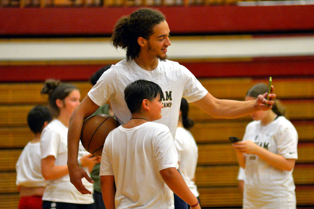 RYAN SPARKS | THE DAILY WORLD NBA player CJ Elleby takes a selfie with a future NBA hopeful at the Hoquiam Youth Basketball Camp on Thursday at Hoquiam High School.