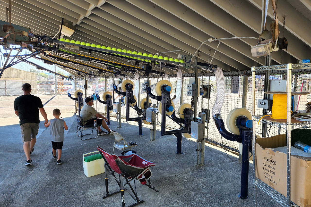 RYAN SPARKS | THE DAILY WORLD The pitching machines at Mr. T’s Bat-O-Rama had been refurbished and were running at full capacity for Sunday’s grand re-opening of the facility, which had been closed for eight years.