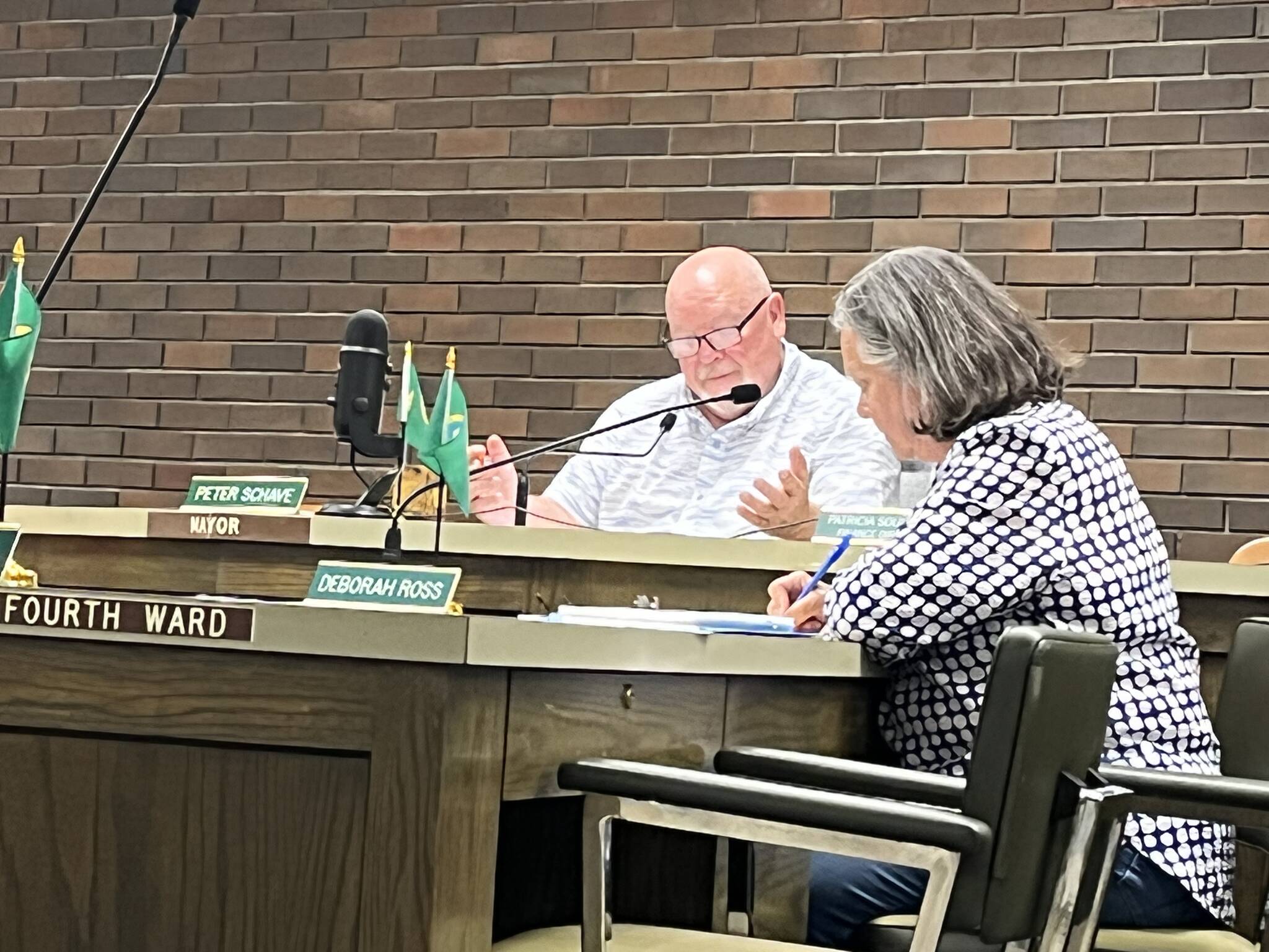 Mayor Pete Schave talks during the Aberdeen City Council meeting on Wednesday night, Aug. 11, 2022, while Ward 4 Position 8 council member Deborah Ross focuses in. (Matthew N. Wells | The Daily World)