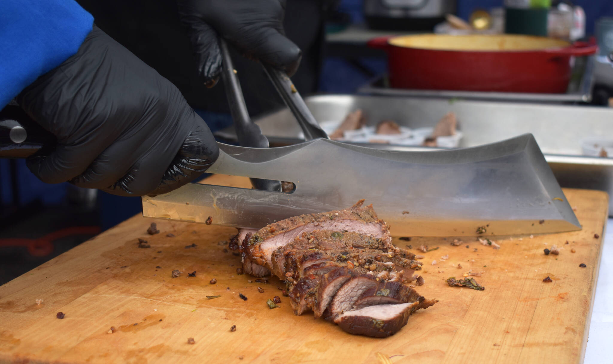 Chef Ron Wisner, of Frontager’s Pizza Co. slices tri tip on his carving board at SummerFest 2022 in Aberdeen.