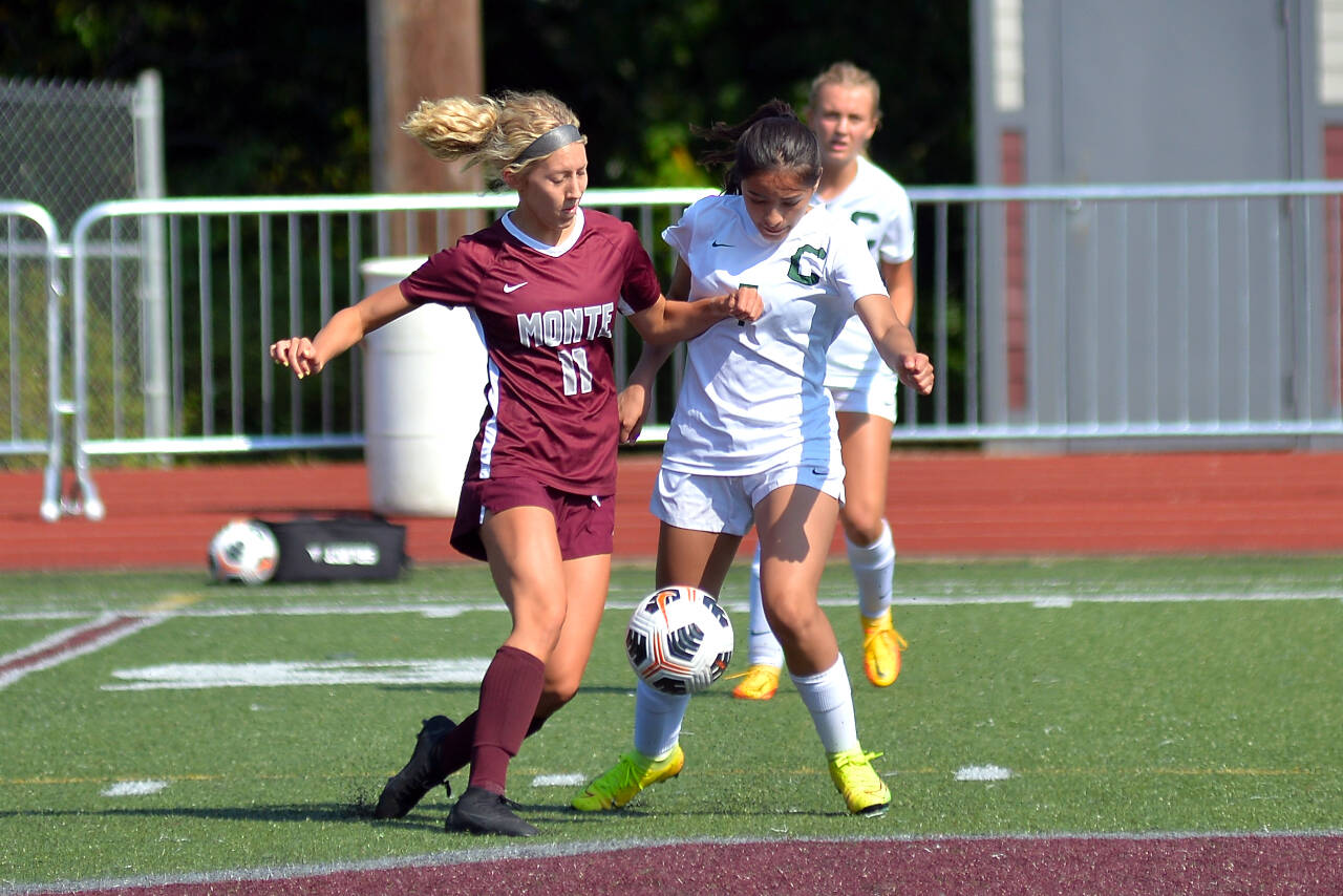 RYAN SPARKS | THE DAILY WORLD Montesano forward Lilly Causey (11) battles for possession with Chelan’s Kenia Sanchez during the Bulldogs’ 5-0 season-opening victory on Friday, Nov. 2, 2022 in Montesano. Causey scored two goals in the contest.