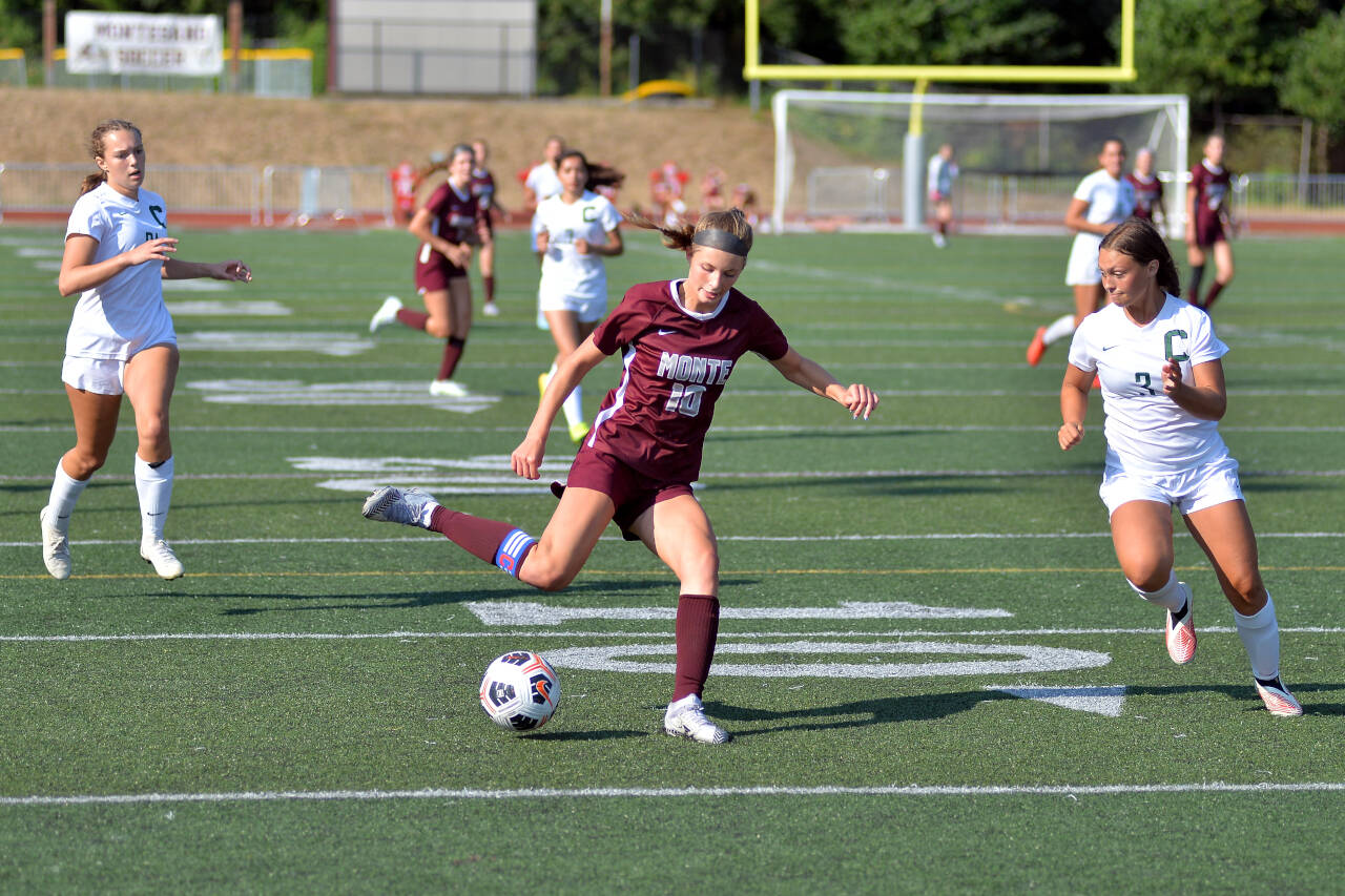 RYAN SPARKS | THE DAILY WORLD Montesano forward Mikayla Stanfield looks to get past Chelan defender Joslynn Simmons (3) during Monte’s 5-0 win on Friday, Sept. 2, 2022 at Jack Rottle Field in Montesano. Stanfield scored two goals in the season-opening victory.