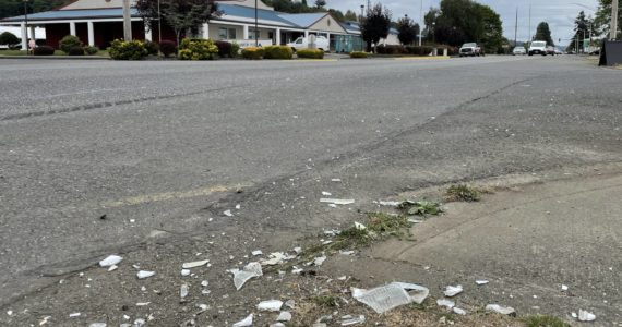 Debris from a motor vehicle crash decorates the corner of Sumner Avenue and Myrtle Street following a two-car crash on Tuesday, Sept. 13, 2022. (Michael S. Lockett | The Daily World)
