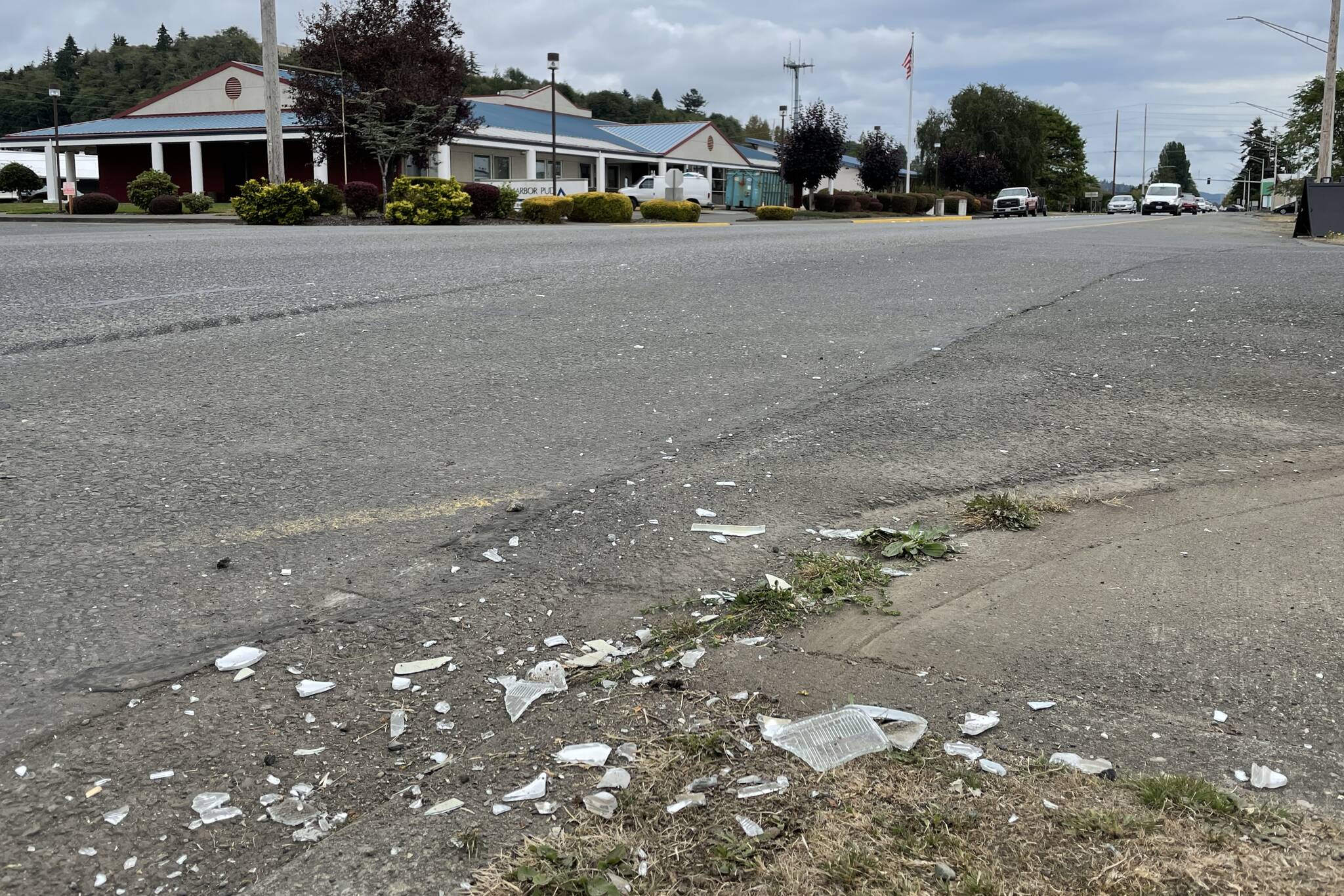 Debris from a motor vehicle crash decorates the corner of Sumner Avenue and Myrtle Street following a two-car crash on Tuesday, Sept. 13, 2022. (Michael S. Lockett / The Daily World)