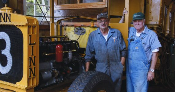 (Provided photo)
Larry Wyrick, left, and Lee Thomasson, right, pose for a photo in front of the 1933 Linn Halftrack tractor that they worked to make run again. According to Thomasson, the machine hadn’t run in about 25 to 30 years before they got it up and running.