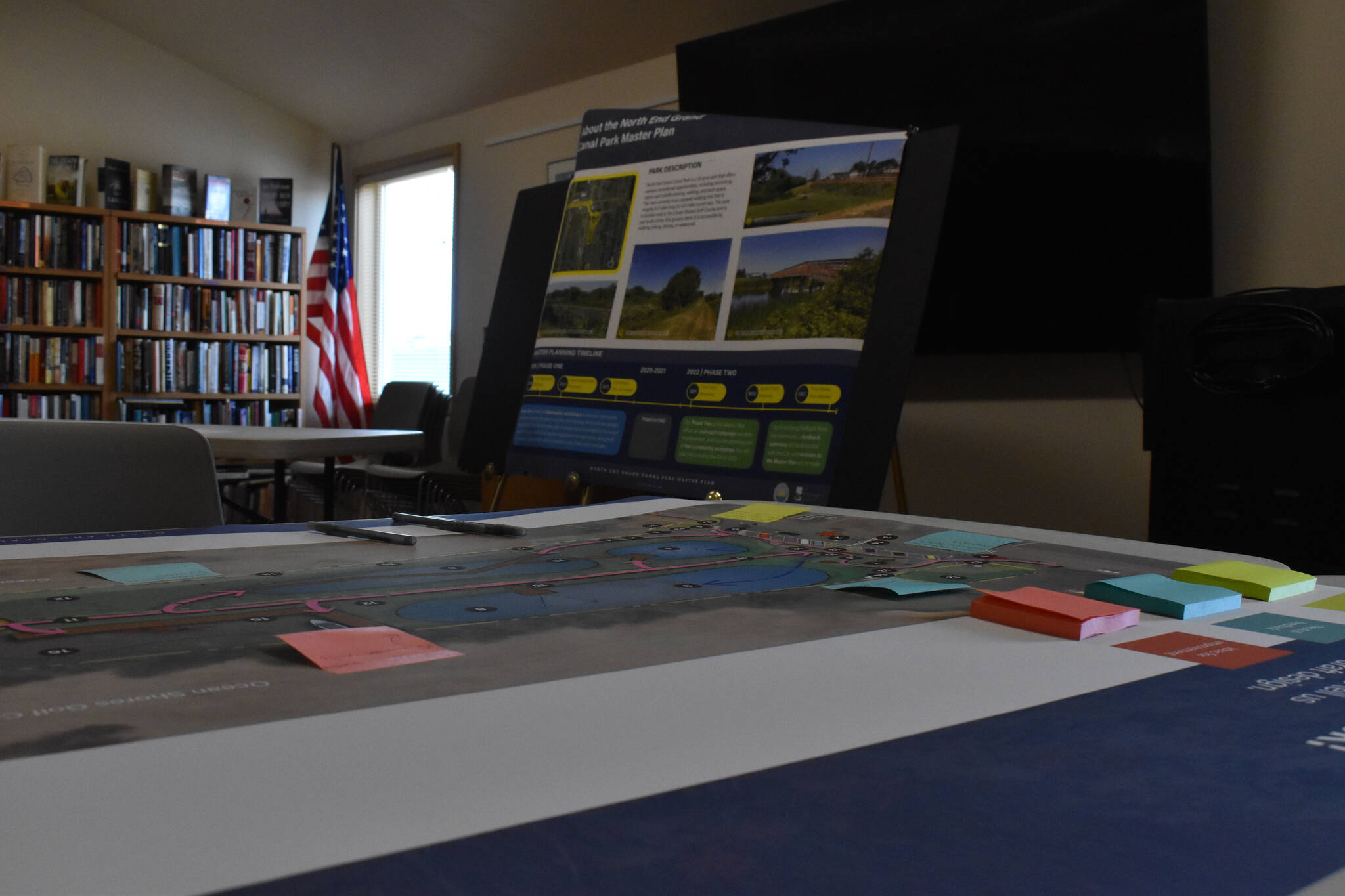The Watershed Company displayed park plans on posters and garnered feedback from the public at a workshop on Friday, Sept. 23 at the Ocean Shores library. (Clayton Franke | The Daily World)