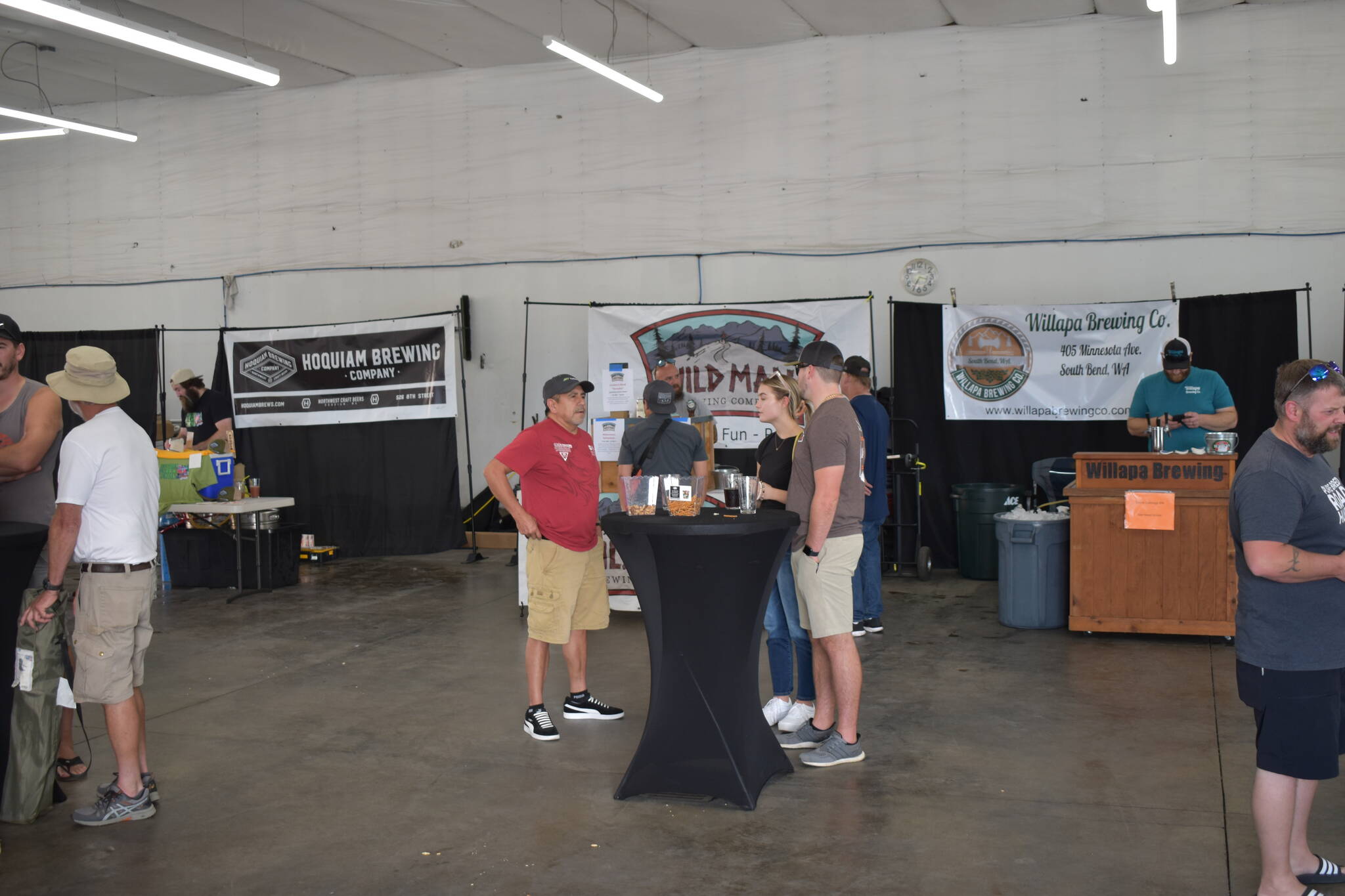 Allen Leister | The Daily World 
Five breweries based across Grays Harbor County provided their services for the Monte Brew Fest on Saturday in Montesano. All alcohol vendors were stationed inside Whitney’s Auto Detail and provided people a reprieve from the warm sunny weather.