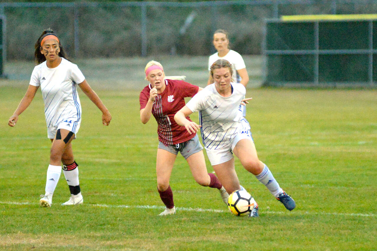 RYAN SPARKS | THE DAILY WORLD Elma midfielder Amaya Lewis, right, competes for possession with Hoquiam’s Chloey Dietrick during the Eagles’ 4-0 victory on Tuesday at Olympic Stadium in Hoquiam.