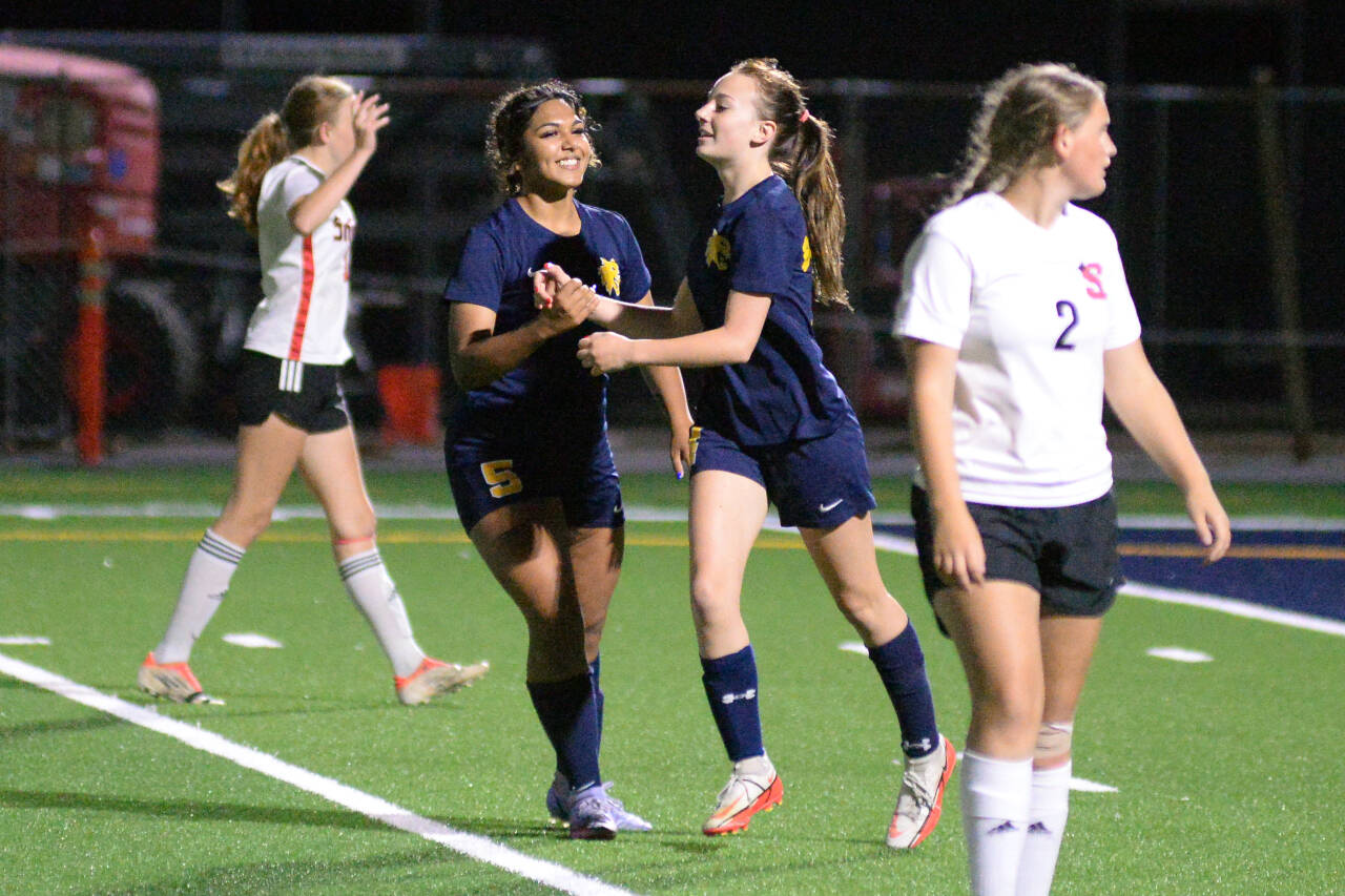 RYAN SPARKS | THE DAILY WORLD Aberdeen co-captain Aman Cheema (5) celebrates with forward Annie Troeh after Troeh scored in the second half of the Bobcats 3-0 victory on Thursday, Sept. 29, 2022 at Stewart Field in Aberdeen.