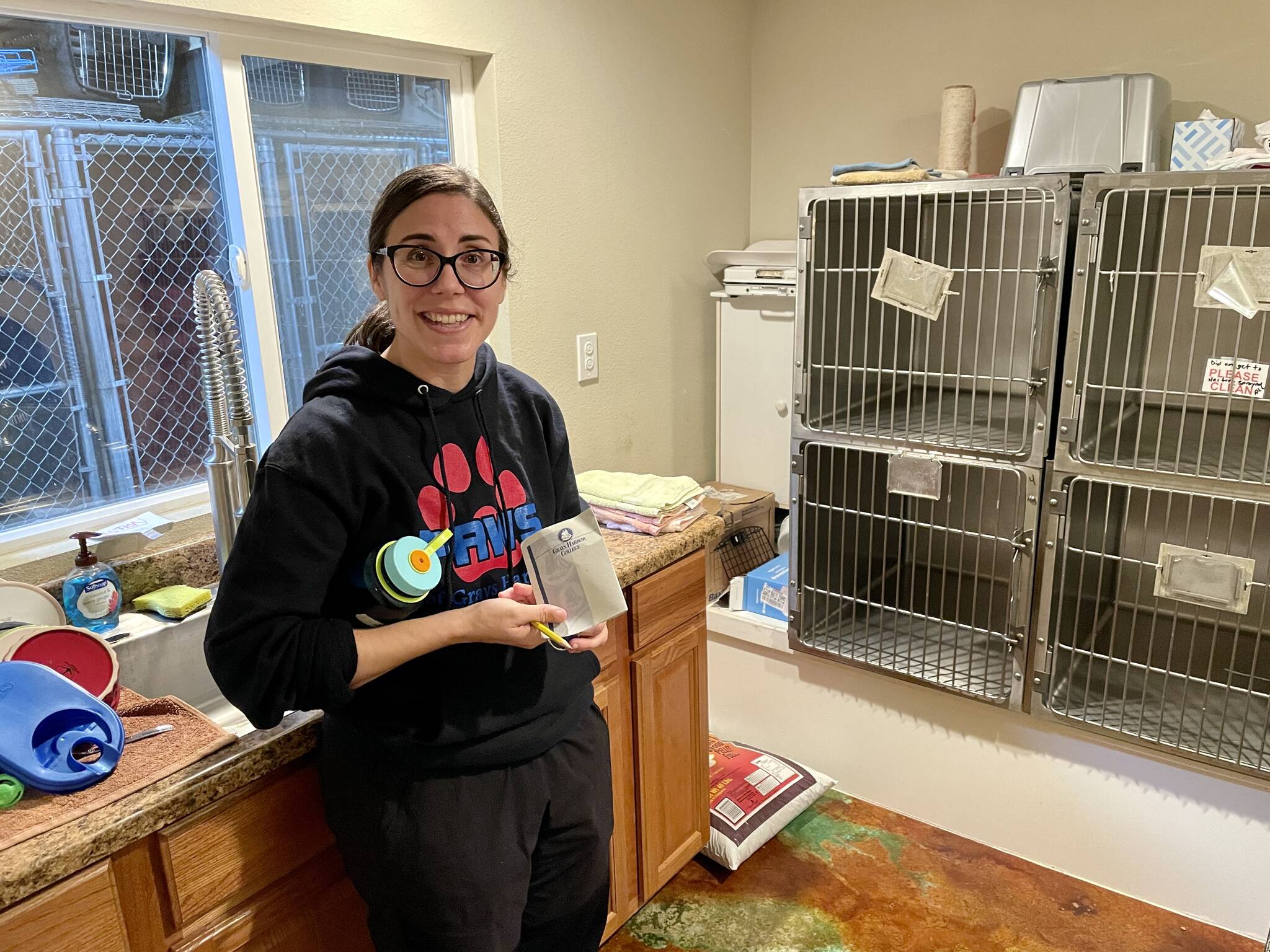 Anne Boeche, executive director of PAWS of Grays Harbor, shows off the shelter’s quarantine room on Oct. 4. The shelter is holding a fundraiser on Oct. 8 to raise money for renovations. (Michael S. Lockett | The Daily World)