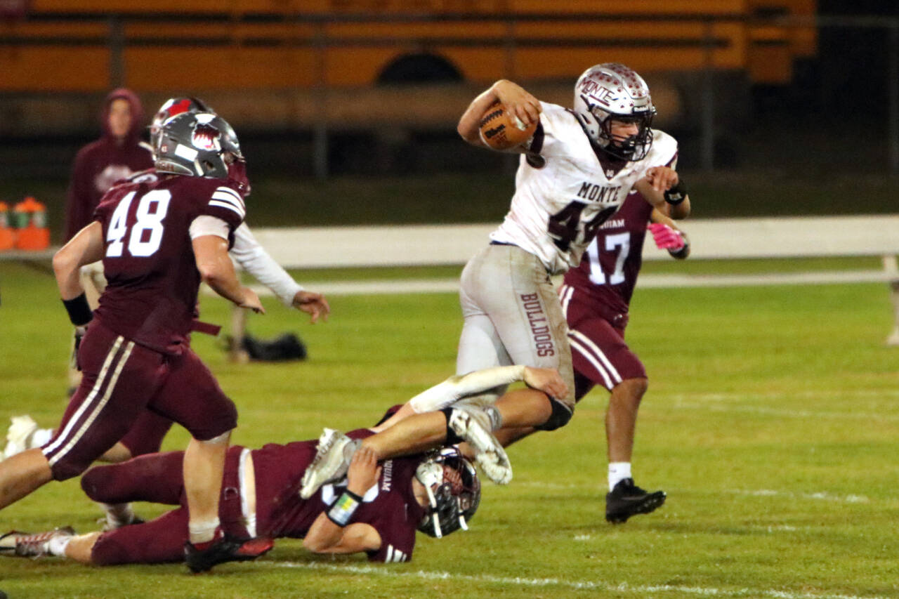 PHOTO BY BEN WINKELMAN 
Montesano running back Gabe Bodwell (44) is tackled by Hoquiam’s Zander Jump during the Bulldogs’ 47-6 victory on Friday at Olympic Stadium in Hoquiam.