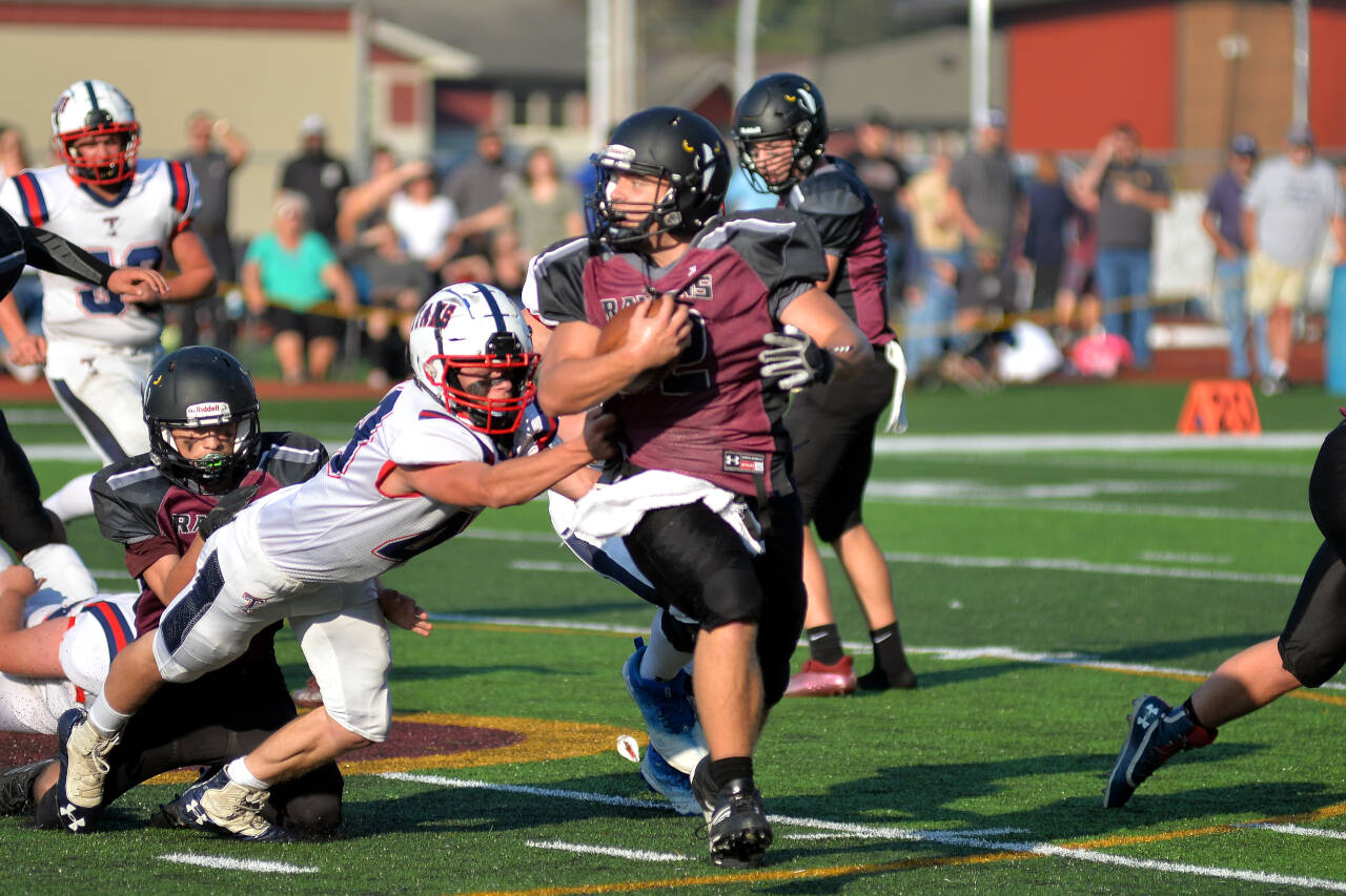 RYAN SPARKS | THE DAILY WORLD Raymond-South Bend running back Ty Reidinger carries the football during the Ravens’ 28-14 loss to Pe Ell-Willapa Valley on Saturday in South Bend. Reidinger had 93 rushing yards in the game.