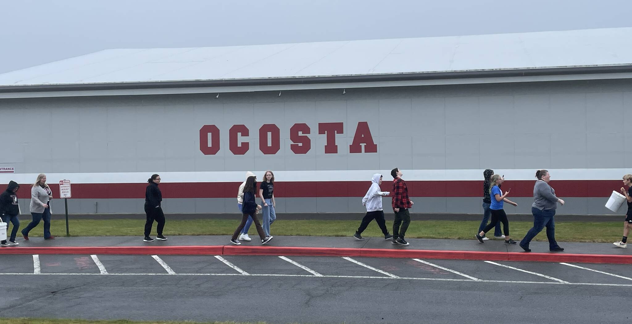 Students at Ocosta Junior-Senior High School walk to the adjacent vertical tsunami shelter on Oct. 20 as part of the Great ShakeOut, a statewide tsunami drill. (Michael S. Lockett / The Daily World)