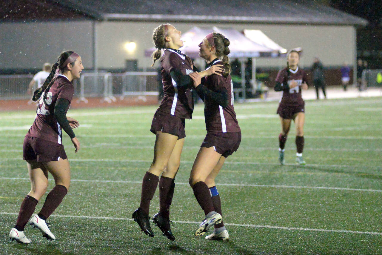 RYAN SPARKS | THE DAILY WORLD Montesano forward Lilly Causey, middle, celebrates with teammates Mikalya Stanfield, right, and Bethanie Henderson after scoring a goal in the first half of Montesano’s 4-3 win over WF West on Tuesday in Montesano.