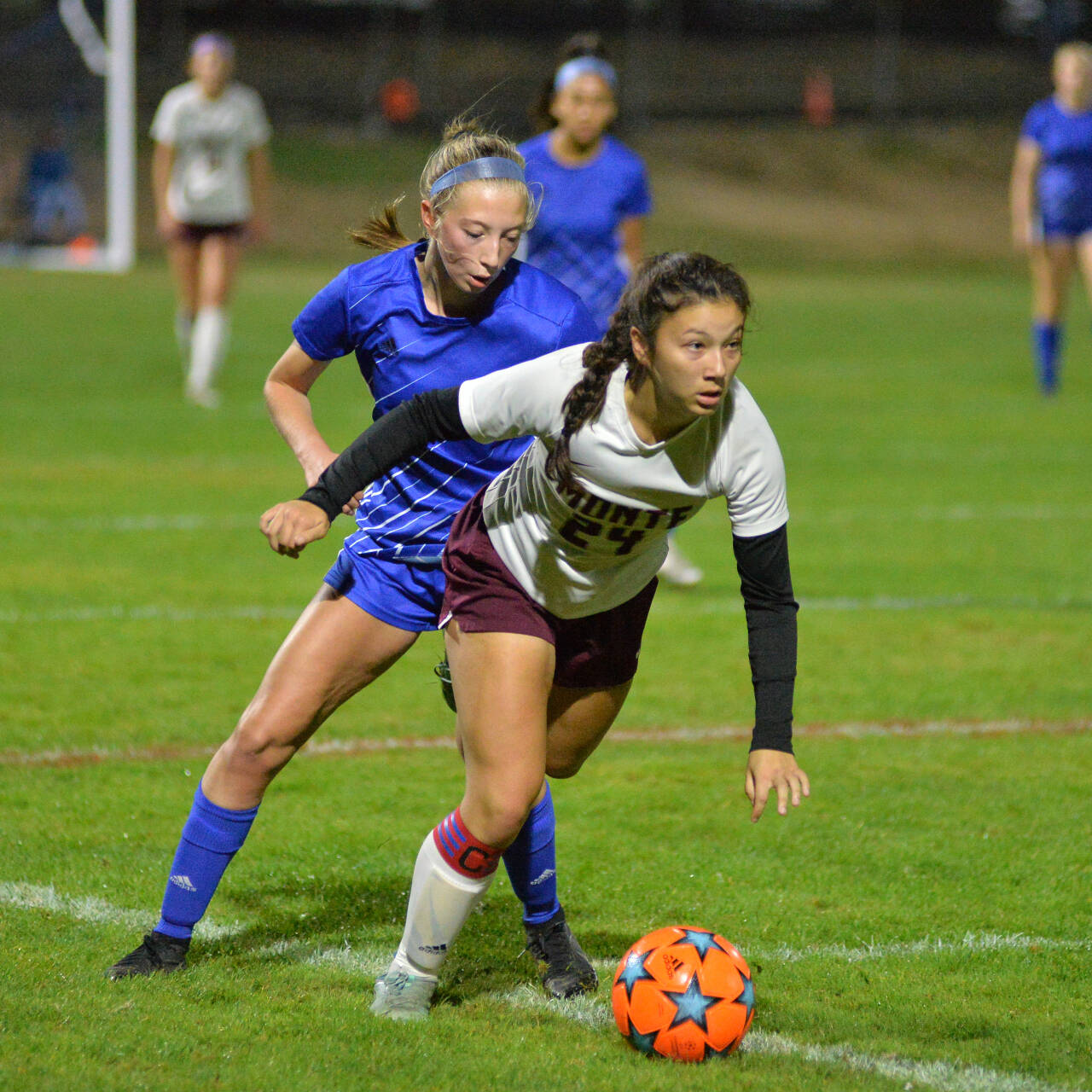 DAILY WORLD FILE PHOTO 
Montesano senior midfielder Vanna Prom (24) shields the ball from Elma’s Beta Valentine during a game earlier this season. Prom was named to the 1A Evergreen League First Team on Tuesday.