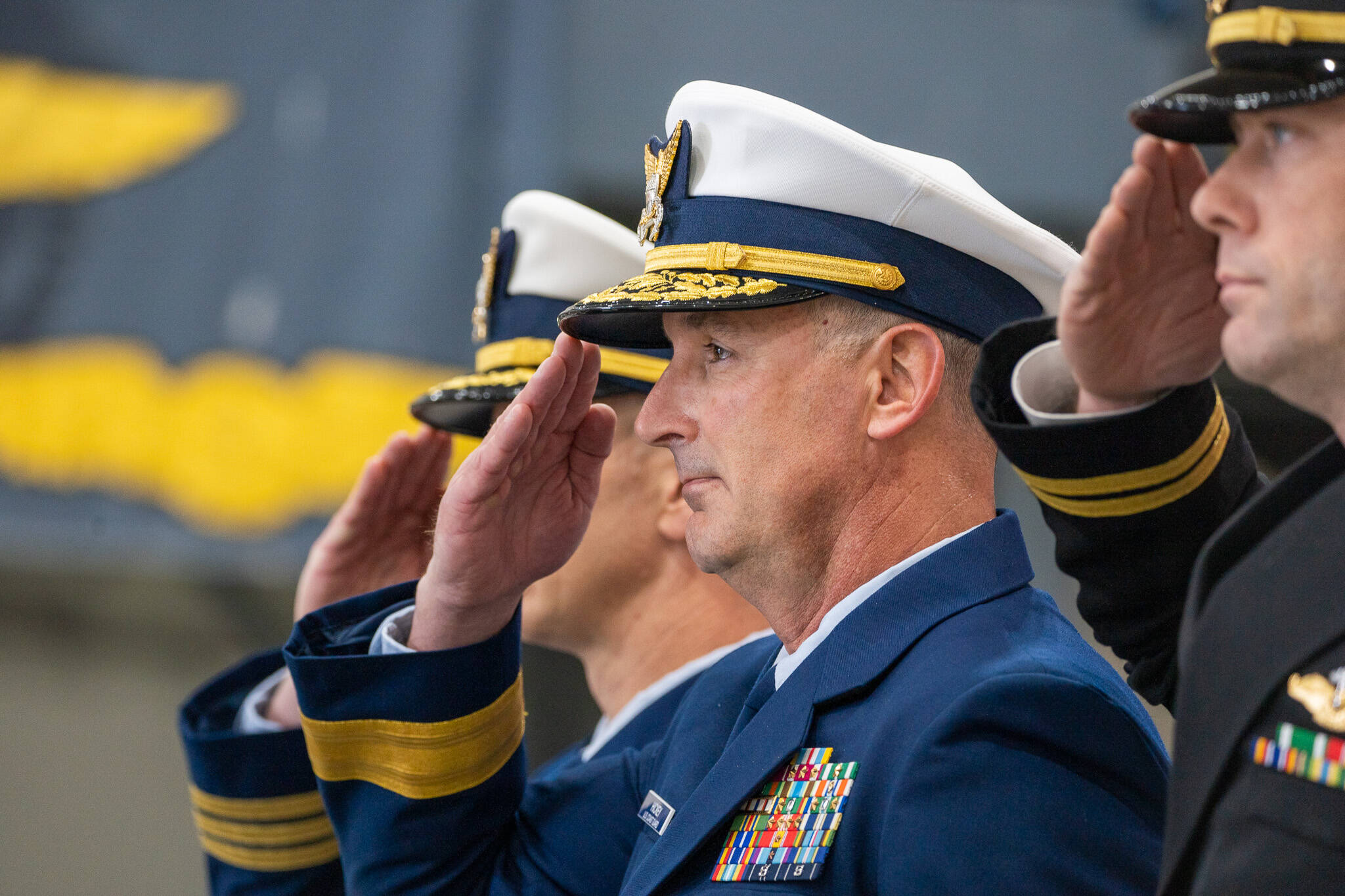 Petty Officer 1st Class Travis Magee / USCG 
Rear Adm. Jon Hickey, the Director of Operational Logistics, salutes during an establishment ceremony in Warrenton, Oregon, to formally establish Coast Guard Base Astoria Oct. 26.
