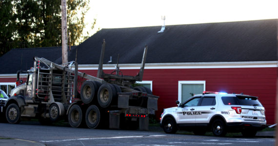 Michael S. Lockett / The Daily World 
A log truck struck two students in a crosswalk in Hoquiam on Nov. 8, noncritically injuring them.