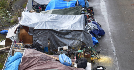 Matthew N. Wells / The Daily World 
A homeless encampment sits south of Aberdeen’s downtown core Thursday, with tented roofs, old bicycles and a few shopping carts that homeless residents have compiled for shelter.