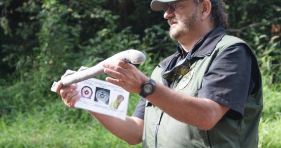 Fish biologist Curt Holt holds a Pacific Lamprey replica during a talk in the field.
WDFW photographs