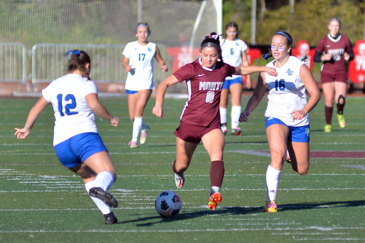 RYAN SPARKS / THE DAILY WORLD Montesano forward/midfielder Adda Potts (8) looks to shoot while being defended by Lakeside (Nine Mile Falls) defenders Jamie Katz (12) and Brooklyn More during the Bulldogs’ 1-0 victory on Saturday at Jack Rottle Field in Montesano.