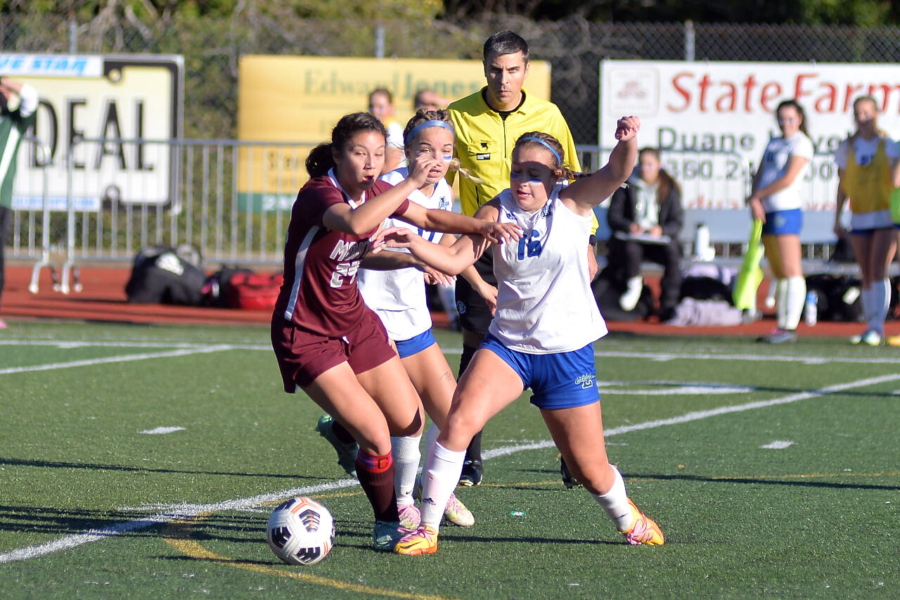 RYAN SPARKS / THE DAILY WORLD 
Montesano midfielder Vanna Prom (24) competes for possession with Lakeside (Nine Mile Falls) defender Brooklyn More (16) during the Bulldogs’ 1-0 victory over in the 1A State Tournament quarterfinals on Saturday at Jack Rottle Field in Montesano.