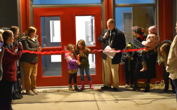 Allen Leister / The Daily World 
After nearly a year of construction, dozens of families gathered around as two children cut the ceremonial ribbon during the formal opening of the new Oakville Elementary School on Wednesday, Nov. 9, in Oakville.