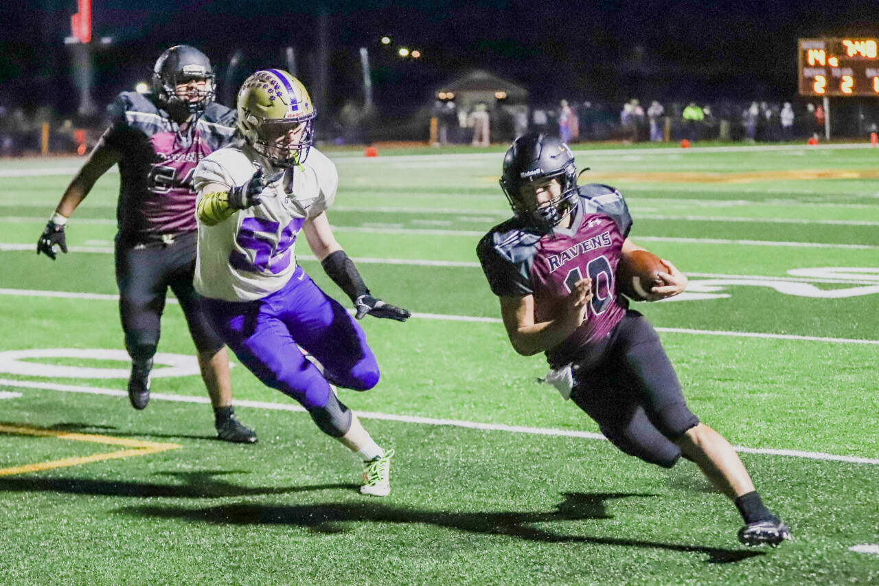 PHOTO BY LARRY BALE 
Raymond-South Bend running back Ferrill Johnson (10) turns the corner during a 54-0 win over Adna in the 2B State playoffs last week. The Ravens will face league-rival Pe Ell-Willapa Valley in the state quarterfinals on Friday in Montesano.