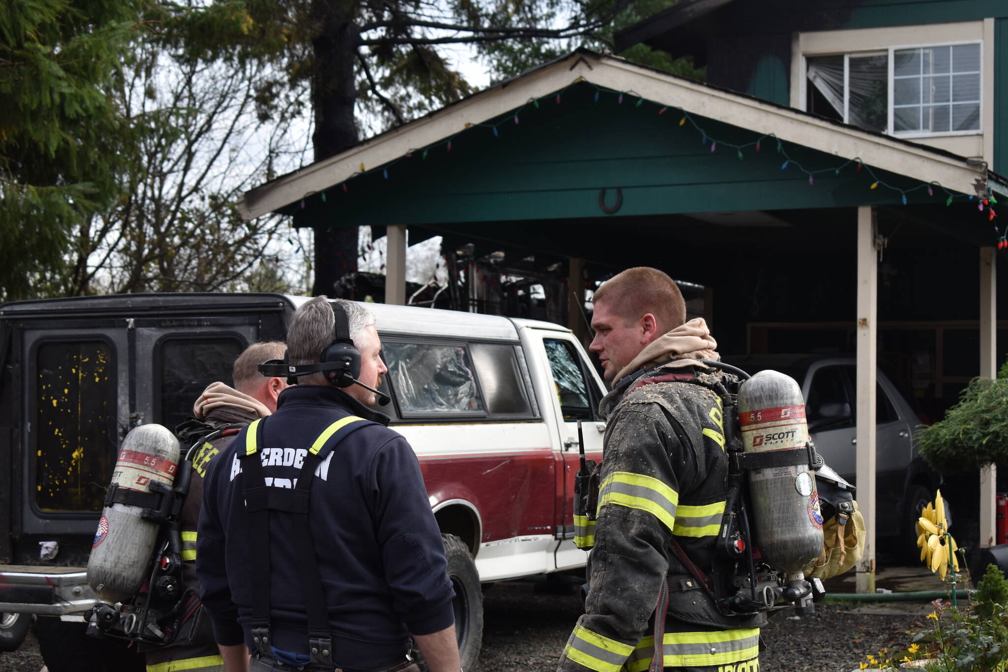 Firefighters attend the scene of a fire in South Aberdeen that began in an RV on Thursday, Nov. 10. (Clayton Franke / The Daily World)
