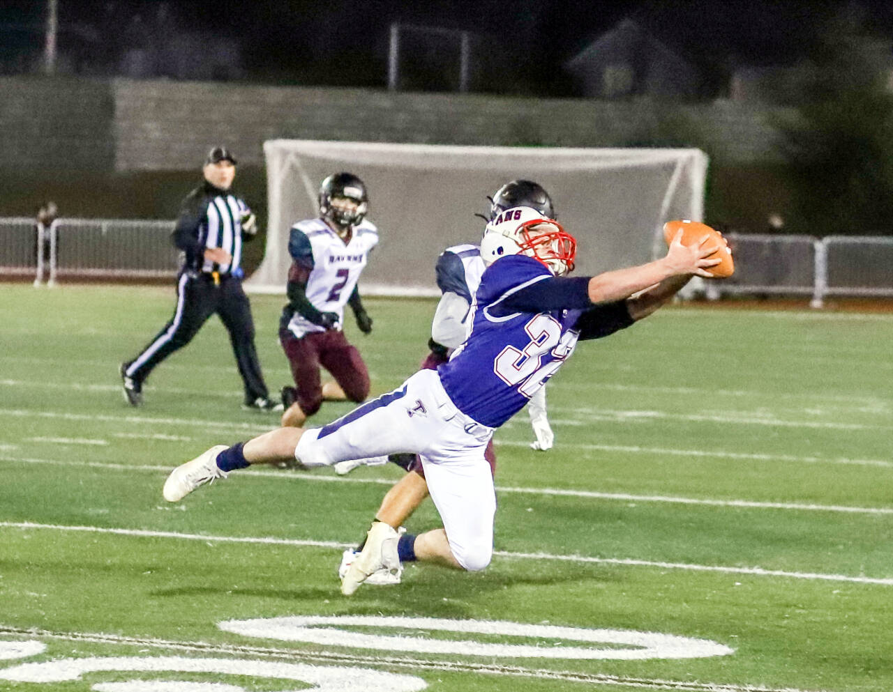 PHOTO BY LARRY BALE Pe Ell-Willapa Valley running back Blake Howard makes a diving catch during the first half of the Titans’ 34-13 win over Raymond-South Bend in a 2B State quarterfinal game Friday in Montesano.