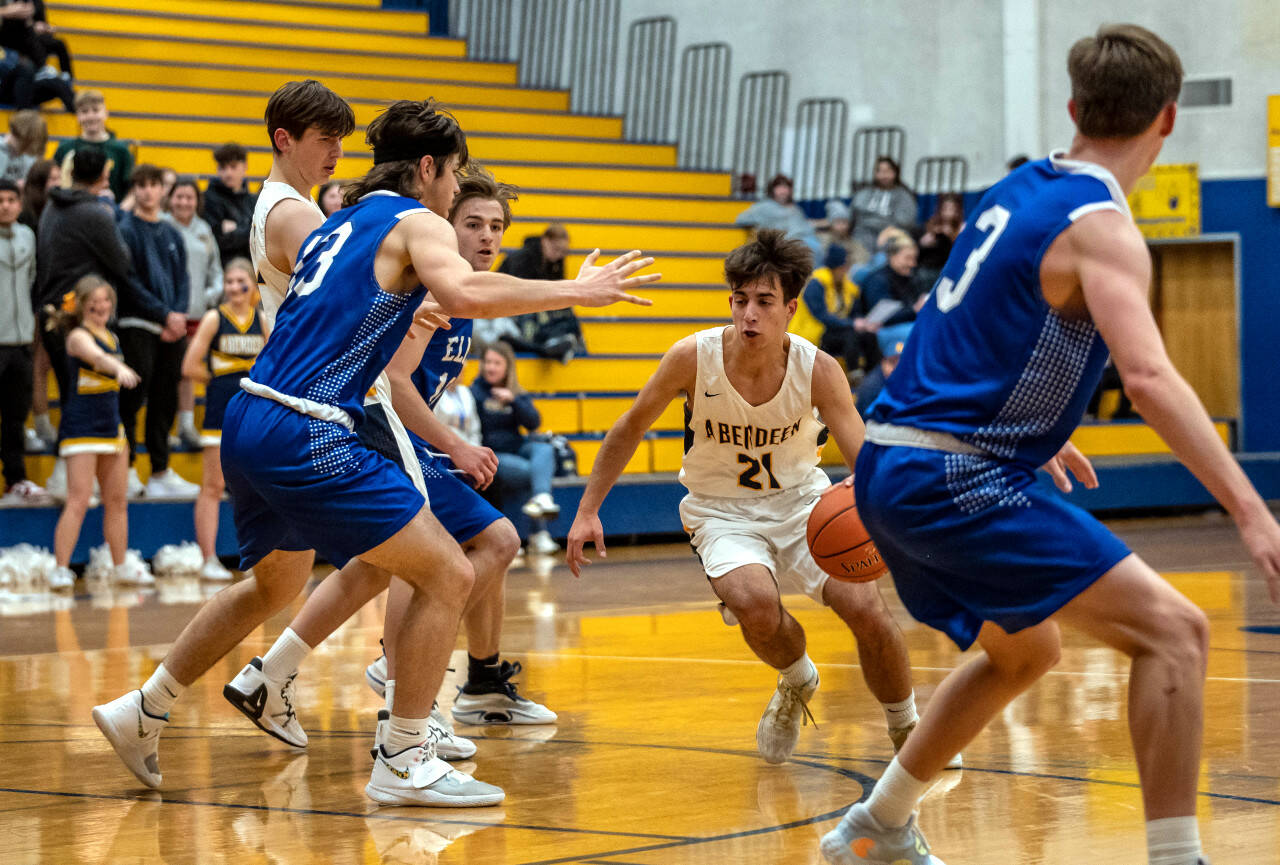 PHOTO BY FOREST WORGUM 
Aberdeen’s Giovanni Ambrogiani (21) drives against the Elma defense in the Bobcats’ 71-49 loss on Monday in Aberdeen.