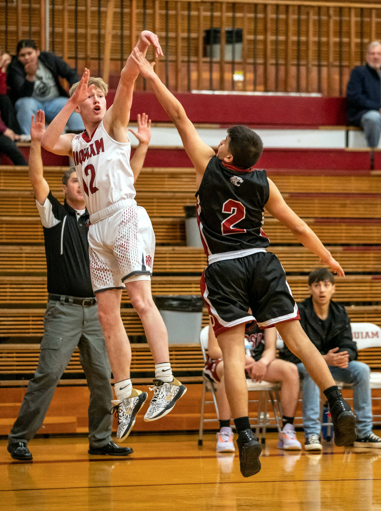 PHOTO BY FOREST WORGUM Hoquiam’s Michael Lorton Watkins (12) puts up a shot over Ocosta’s Kevin Agramon during the Grizzlies’ 69-35 victory on Friday in Hoquiam. Lorton Watkins led all scorers with 22 points.