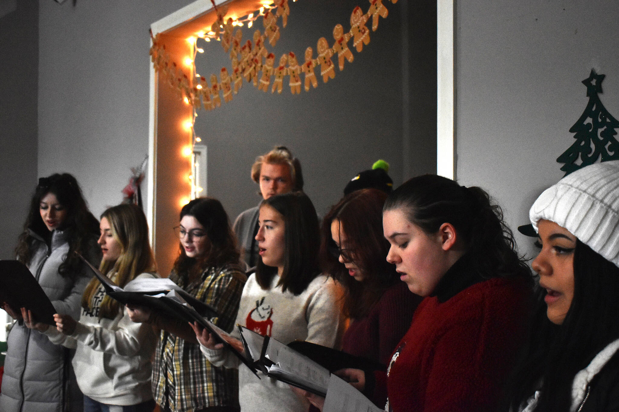 Clayton Franke / The Daily World
The Goldenaires, a local high school a cappella group, provide a Christmas serenade for those perusing Saturday’s gingerbread house display in the Go Get the Pho restaurant building.