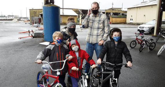 In a past year, the Delimonts — Joseph, 8, Eliot, 6, and Jarom, 9, show off their new bikes they got from “Bicycles from Heaven,” with their parents Kina and David (from left.)