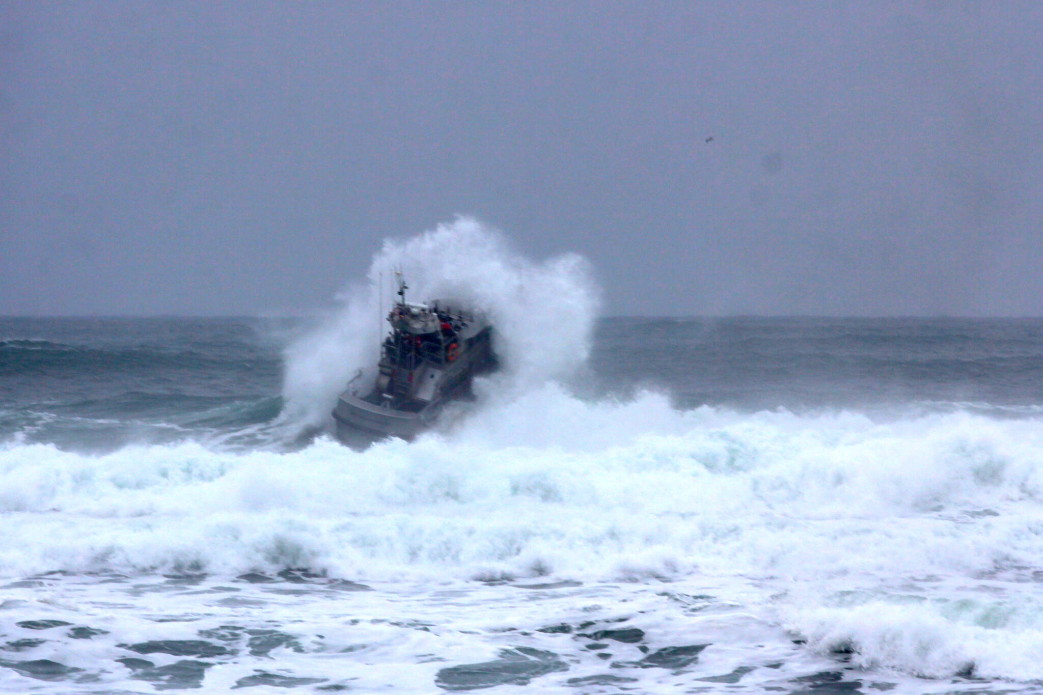 U.S. Coast Guard rescue vessels from Station Grays Harbor practice operating in heavy surf conditions on Dec. 9, 2022. (Michael S. Lockett / The Daily World)